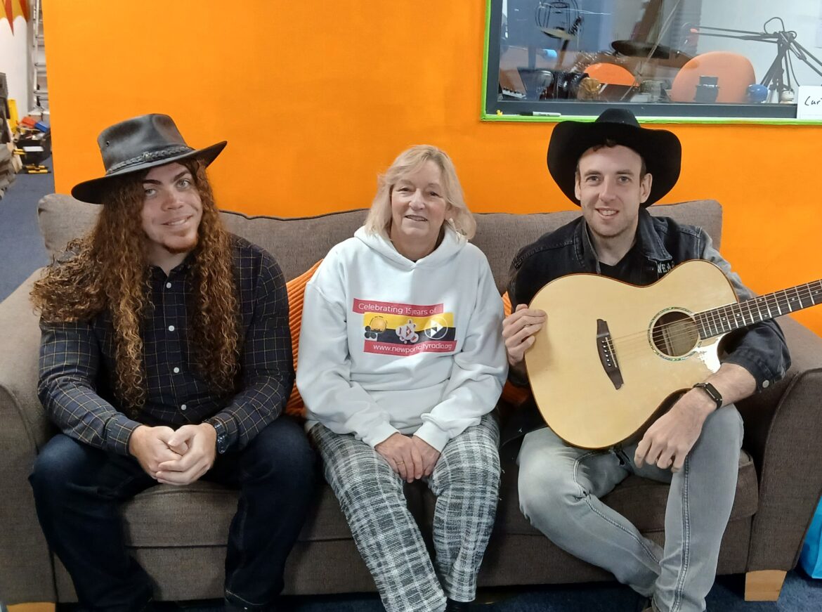 Kori, Kym and Cole sat in Newport City Radio HQ.