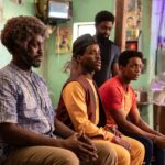 The Doctor sat with other people in the barbershop