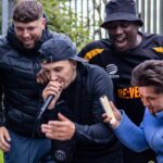 Artist Murkage at a cypher surrounded by friends