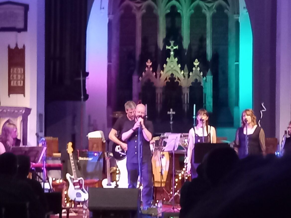 Spencer Segelov and his band on stage performing his greatest hits