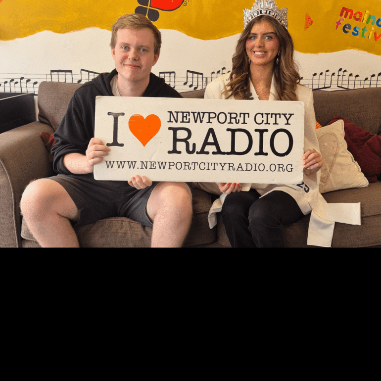 Luke sat on sofa with Miss Newport